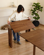 Table transformable en noyer
